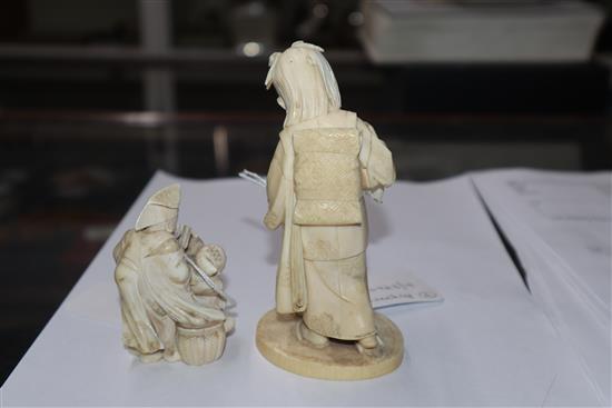 A Meiji carved ivory group of two children (damaged) on hardwood stand and a smaller group tallest 14cm incl. stand
